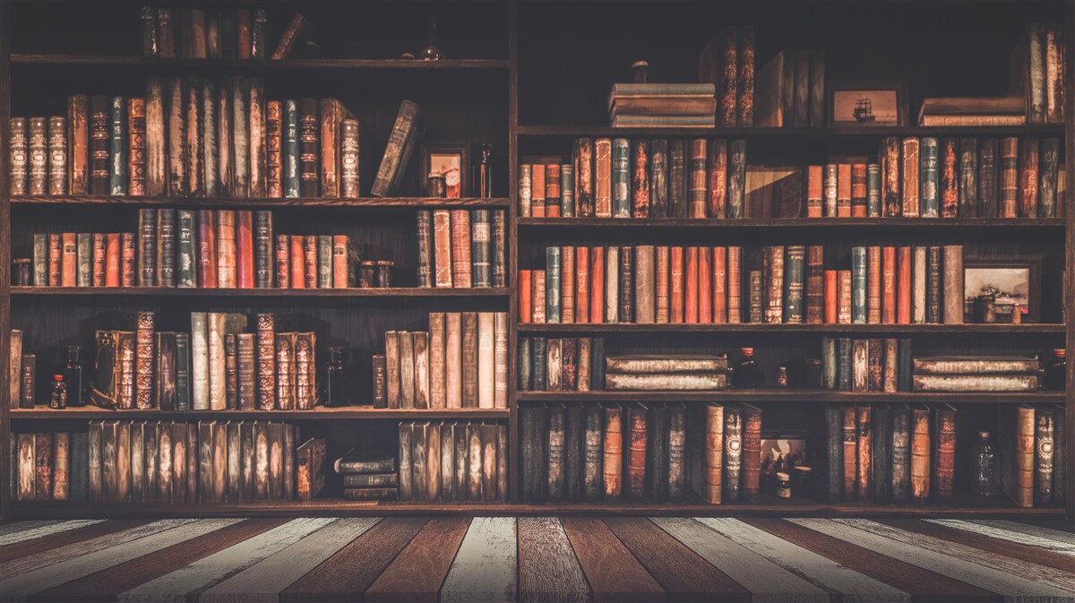 Фотошпалери книжки, нагромаджені на полицях